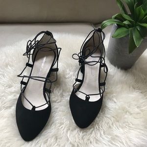 Black suede ‘Intentionally Blank’ designer pumps